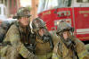 John Travolta , Kevin Chapman and Joaquin Phoenix in Touchstone's Ladder 49